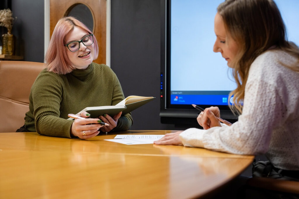 Charlotte talking to a school teacher